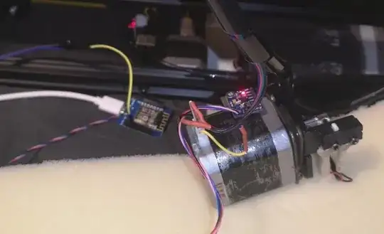 picture of stepper motor with accelerometer tucked between motor and console