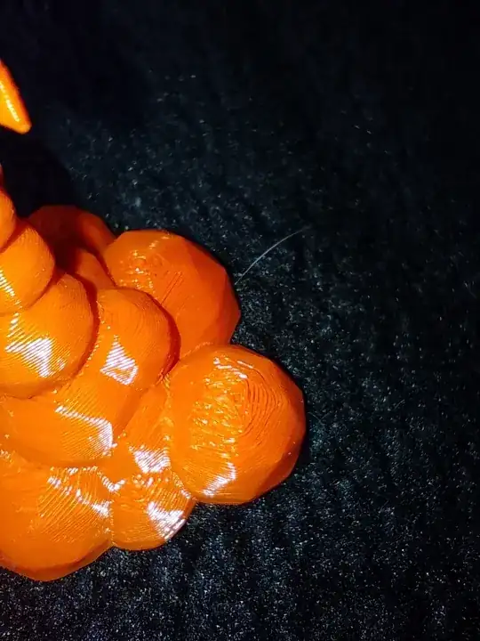 Photo of a 3D printed model with printing errors on the top Photo of a 3D printed model with printing errors on the top