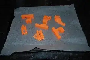 Failed 3D prints on a baking tray