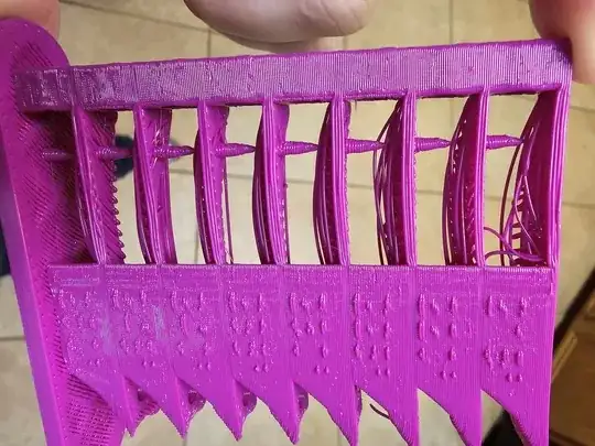 Another photo of a temperature tower where the numbers on the side are not legible due to poor extrusion Another photo of a temperature tower where the numbers on the side are not legible due to poor extrusion